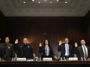 U.S. Border Patrol Chief Carla Provost, left, Customs and Border Protection Office of Field Operations Executive Assistant Commissioner Todd Owen, Department of Homeland Security Acting Executive Associate Director of Enforcement and Removal Operations Nathalie Asher, Office of Refugee Resettlement Director Jonathan Hayes, and Joint Task Force West Director Manuel Padilla Jr., are sworn in for a Senate Judiciary Border Security and Immigration Subcommittee hearing about the border, Wednesday May 8, 2019, on Capitol Hill in Washington.