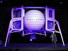 Jeff Bezos speaks in front of a model of Blue Origin's Blue Moon lunar lander, Thursday, May 9, 2019, in Washington.