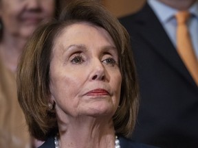 House Speaker Nancy Pelosi, D-Calif., stands at a Democratic event ahead of a House floor vote on the Health Care and Prescription Drug Package, at the Capitol in Washington, Wednesday, May 15, 2019. Earlier, at the National Peace Officers Memorial Day service, Attorney General William Barr asked Pelosi, "Madam Speaker, did you bring your handcuffs?" a reference to Barr's refusal to comply with congressional subpoenas related to special counsel Robert Mueller's report.