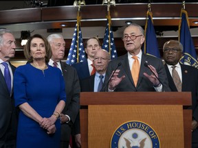 Speaker of the House Nancy Pelosi, D-Calif., left, Senate Minority Leader Chuck Schumer, D-N.Y., center, and other congressional leaders, react to a failed meeting with President Donald Trump at the White House on infrastructure, at the Capitol in Washington, Wednesday, May 22, 2019. From left are House Ways and Means Committee Chairman Richard Neal, D-Mass., Speaker Pelosi, House Majority Leader Steny Hoyer, D-Md., Sen. Ron Wyden, D-Ore., House Transportation and Infrastructure Committee Chair Peter DeFazio, D-Ore., Schumer, and House Majority Whip James E. Clyburn, D-S.C.