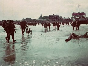 Canadian soldiers land on a Normandy, France beach during the D-Day invasion June 6, 1944.