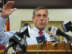FILE - In this Friday, Sept. 1, 2017, file photo, Gov. John Carney speaks at a news conference in Wilmington, Del. Delaware's attorney general is investigating the medical contractor for the state's prison system amid allegations that contract counselors were ordered to forge documents to indicate that inmates were getting mental health treatment they never received. "It's upsetting that so many years down the road, and we're still not apparently getting what we're paying for," a frustrated Carney said Tuesday, May 14, 2019. "That's just unacceptable."