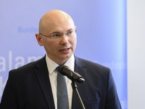 Police speaker Georg Ungefug talks to the media on Friday, May 3, 2019 at a press conference in Wiesbaden, Germany, about European and American investigators breaking up one of the world's largest online criminal trafficking operations, which was allegedly responsible for the international trafficking of drugs, as well as forged documents and other illegal materials. Three German men, ages 31, 22 and 29, were arrested on allegations they operated the so-called "Wall Street Market" Darknet platform. In Los Angeles, two drug suppliers were arrested and authorities confiscated some $1 million, drugs and weapons.