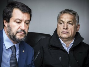 In this handout photo provided by the Hungarian Prime Minister's Press Office shows Hungarian Prime Minister Viktor Orban, right, and Italian Interior Minister Matteo Salvini during their visit at the Hungarian-Serbian border near Roszke, 180 kms southeast of Budapest, Hungary, Thursday, May 2, 2019.