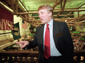 Donald Trump above the floor of the New York Stock Exchange after taking his flagship Trump Plaza Casino public in June 1995.