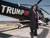 Donald Trump stands next to one of his three Sikorsky helicopters in March 1988.