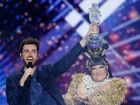 Duncan Laurence of the Netherlands, winner of the 2019 Eurovision Song Contest, performs with trophy in hand, alongside 2018 winner Netta Barzilai of Israel, in Tel Aviv on May 18, 2019.