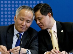 Tran Quoc Khanh, Vietnam's Deputy Minister of Industry and Trade, left, talks with Singapore's Industry and Trade Minister Chan Chun Sing, during a meeting of the Comprehensive and Progressive Agreement for Trans-Pacific Partnership, CP TPP, in Santiago, Chile, Thursday, May 16, 2019.