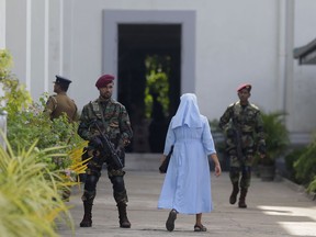 Sri Lankan army commando soldiers secure the St. Lucia's Cathedral during a holy mass held to bless the victims of Easter Sunday attacks in Colombo, Sri Lanka, Saturday, May 11, 2019. In the two Sundays that followed Easter, most churches were closed with armed guards.