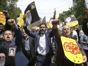 Worshippers chant slogans against the United States and Israel during a rally after Friday prayers in Tehran, Iran, Friday, May 10, 2019. A top commander in Iran's powerful Revolutionary Guard said Friday that Tehran will not talk with the United States, an Iranian news agency reported -- a day after President Donald Trump said he'd like Iranian leaders to "call me."