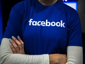 Guest are welcomed by people in Facebook shirts as they arrive at a Facebook Canadian Summit in Toronto on Wednesday, March 28, 2018. Politicians are increasingly concerned that social media giants have become so big, powerful and rich that they are effectively above the law at least in a small country like Canada.