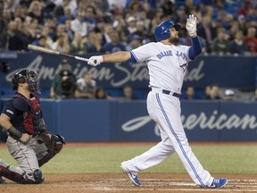 Toronto Blue Jays' Rowdy Tellez hits a three run home run against the Boston Red Sox in the fifth inning of their American League MLB baseball game in Toronto on Tuesday May 21, 2019. It was his second home run in the game.