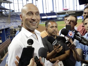 Miami Marlins CEO Derek Jeter talks with the news media before a baseball game against the Atlanta Braves, Friday, May 3, 2019, in Miami.