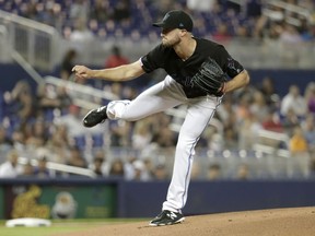 Miami Marlins starting pitcher Trevor Richards follows through on a delivery during the first inning of the team's baseball game against the Atlanta Braves, Saturday, May 4, 2019, in Miami.