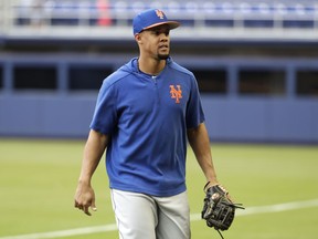 New York Mets' outfielder Carlos Gomez walks on the field before a baseball game against the Miami Marlins, Friday, May 17, 2019, in Miami. New York selected Gomez's contract from Triple-A Syracuse and have him batting sixth and in right field against the Marlins on Friday.