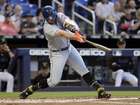 New York Mets' Pete Alonso hits a solo home run during the second inning of the team's baseball game against the Miami Marlins, Friday, May 17, 2019, in Miami.