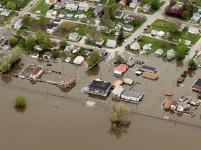 An aerial photo shows the Mississippi River flooding in Buffalo, Iowa, Friday, May 3, 2019. The National Weather Service issued flood warnings Friday along a large swath of the Mississippi River.