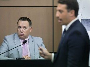 Jupiter Police Detective Andrew Sharp is questioned by Alex Spiro, right, attorney for New England Patriots owner Robert Kraft, during a motion hearing in the Kraft prostitution solicitation case, Wednesday, May 1, 2019, in West Palm Beach, Fla. Kraft's attorneys argue that undercover surveillance videos allegedly showing their client paying for sex at a Jupiter day spa should be ruled inadmissible and the evidence thrown out.