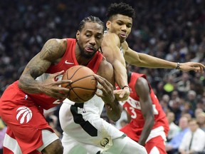 Toronto Raptors forward Kawhi Leonard (2) steals the ball from Milwaukee Bucks forward Giannis Antetokounmpo (34) during first half action in Game 5 of the NBA Eastern Conference final in Milwaukee on Thursday, May 23, 2019.