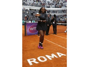 FILE - In this Sunday, May 15, 2016 file photo, Serena Williams poses with the trophy after beating Madison Keys 7-6, 6-3, in the final match of the Italian Open tennis tournament, in Rome. Serena Williams is set to return from injury at the upcoming Italian Open. Tournament director Sergio Palmieri tells The Associated Press that he spoke with Williams' representative "four-five days ago" and that "she has already reserved her rooms and should be here a few days early" for the May 13-19 event.