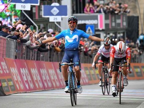 Richard Carapaz of Ecuador celebrates as he crosses the finish line to win the 4th stage of the Giro d'Italia, tour of Italy cycling race, from Orbetello to Frascati, Tuesday, May 14, 2019. Richard Carapaz of Ecuador sprinted to victory in the fourth stage of the Giro d'Italia on Tuesday, while Slovenian cyclist Primoz Roglic kept the overall lead after avoiding a crash toward the end of the route.