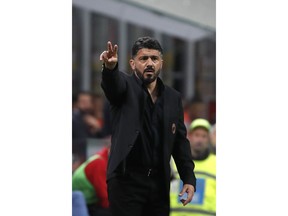 AC Milan coach Gennaro Gattuso gestures during the Italian Serie A soccer match between AC Milan and Bologna at the San Siro stadium, in Milan, Italy, Monday, May 6, 2019.