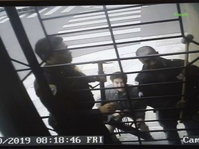 In this May 10, 2019, image from video provided by Bryan Carmody San Francisco police armed with sledgehammers execute a search warrant at journalist Bryan Carmody's home in San Francisco. The San Francisco reporter is seeking the return of property after police raided his home, as officials sought to determine the source of a leaked police report into the death of the city's public defender. An attorney for Carmody will make the request Tuesday, May 21 in San Francisco County Superior Court.