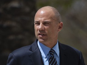 FILE - In this April 1, 2019, file photo, attorney Michael Avenatti arrives at federal court in Santa Ana, Calif. A federal judge has rejected Avenatti's request to be represented by a public defender in a case alleging he stole from clients, cheated on his taxes and committed bank fraud. Judge James Selna denied the request Tuesday, May 14, 2019, on the eve of Avenatti's court appearance in U.S. District Court in Santa Ana, Calif.