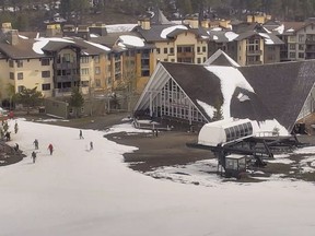 In this webcam image provided by Squaw Valley Alpine Meadows, snow is on the ground at the Squaw Valley Ski Resort base area Wednesday, May 22, 2019, in Olympic Valley, Calif. Memorial Day may be the unofficial start of summer, but California is heading toward the holiday with rainy, windy and snowy weather. The Squaw Valley resort at Lake Tahoe reports it got 32 inches of snow over the past seven days, boosting its season total to 714 inches. Unsettled weather will continue into next week. (Squaw Valley Alpine Meadows via AP)