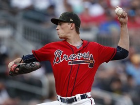 Atlanta Braves starting pitcher Max Fried (54) works in the first inning of a baseball game against the Milwaukee Brewers Friday, May 17, 2019, in Atlanta.