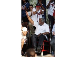 Former Atlanta Braves outfielder Hank Arron waves as former pitcher Phil Niekro applauds during a ceremony to announce that Atlanta will host baseball's 2021 All-Star Game, Wednesday, May 29, 2019, in Atlanta.