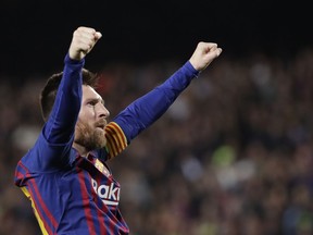Barcelona's Lionel Messi celebrates after scoring his side's third goal during the Champions League semifinal, first leg, soccer match between FC Barcelona and Liverpool at the Camp Nou stadium in Barcelona, Spain, Wednesday, May 1, 2019.