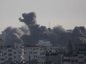 Smoke rises from an explosion after an Israeli airstrike in Gaza City, Sunday, May 5, 2019. The Israeli military said Sunday it had responded to 450 rockets fired from Gaza with over 250 airstrikes against the besieged Palestinian enclave.