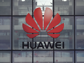 The White House on Wednesday initiated a two-pronged assault on China: barring companies deemed a national security threat from selling to the U.S., and threatening to blacklist Huawei Technologies Co. from buying essential components.