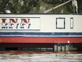 Flood water get close to the high water mark from the 1965 flood under the awning of The Levee Inn in Downtown Davenport on Wednesday, May 1, 2019, in Davenport, Iowa. A flood wall broke on Tuesday sending water to near record levels with little to no warning.