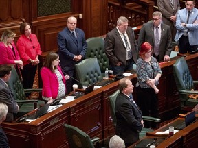 As her colleagues stand around her, Illinois state Rep. Avery Bourne, R-Raymond, speaks against the Reproductive Health Act on the floor of the Illinois House chambers Tuesday, May 28, 2019, in Springfield, Ill. The legislation rewrote Illinois' current abortion law to make it less restrictive and passed 64-50.