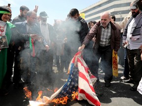 Iranian worshippers burn a representation of a U.S. flag during a rally after Friday prayer in Tehran, Iran, Friday, May 10, 2019. A top commander in Iran's powerful Revolutionary Guard said Friday that Tehran will not talk with the United States, an Iranian news agency reported — a day after President Donald Trump said he'd like Iranian leaders to "call me."