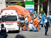 Rescuers work at the scene of a knife attack in Kawasaki, near Tokyo, May 28, 2019.