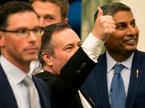 Premier Jason Kenney gestures to the public gallery during the first session of the 30th Alberta Legislature, in Edmonton on May 22, 2019.