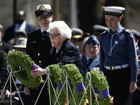 Elsa Lessard, who served in the Women's Royal Canadian Naval Service as a Secret Listener during the Second World War, lays a wreath during a ceremony commemorating the Battle of the Atlantic at the National War Memorial in Ottawa on Sunday, May 5, 2019.