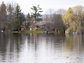 A home off of Beachburg Road by the Ottawa River in Whitewater Region, east of Pembroke, Ontario is completely surrounded by water as flooding continues in the region, on Saturday, May 11, 2019.