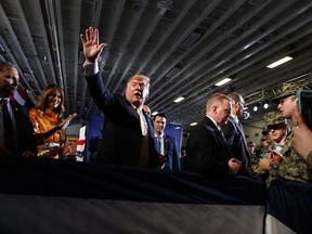 U.S. President Donald Trump talks with troops at a Memorial Day event aboard the USS Wasp amphibious assault ship, Tuesday, May 28, 2019, in Yokosuka, Japan.