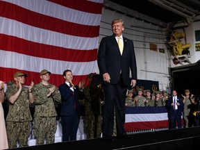 President Donald Trump arrives on stage to speak to troops at a Memorial Day event aboard the USS Wasp, Tuesday, May 28, 2019, in Yokosuka, Japan.
