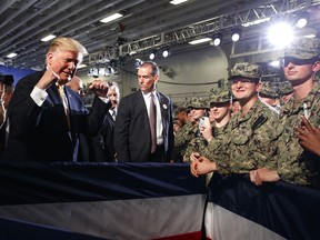 President Donald Trump greets troops after speaking at a Memorial Day event aboard the USS Wasp, Tuesday, May 28, 2019, in Yokosuka, Japan.