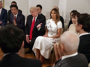 President Donald Trump and first lady Melania Trump along with Japanese Prime Minister Shinzo Abe and his wife Akie Abe meet with Japanese families of those abducted by North Korea, at Akasaka Palace, Monday, May 27, 2019, in Tokyo.