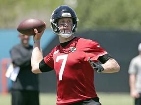 Jacksonville Jaguars quarterback Nick Foles looks for a receiver during an NFL football practice, Thursday, May 30, 2019, in Jacksonville, Fla.