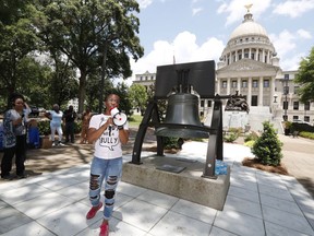Amanda Furdge of Jackson and a mother of three boys, relates her experience seeking an abortion in the state, as she addresses abortion rights advocates at the Capitol in Jackson, Miss., during a rally to voice their opposition to state legislatures passing abortion bans that prohibit most abortions once a fetal heartbeat can be detected, Tuesday, May 21, 2019. The rally in Jackson was one of many around the country to protest abortion restrictions that states are enacting.