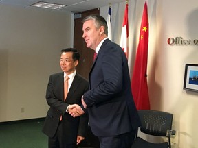 China's ambassador to Canada Lu Shaye shakes hands with Nova Scotia Premier Stephen McNeil in Halifax on Wednesday, May 29, 2019. China's ambassador to Canada is in Nova Scotia for bilateral meetings today with Premier Stephen McNeil and several members of his cabinet. Lu Shaye called McNeil his "great friend" and says Nova Scotia and its premier are at the forefront of cooperative efforts between the provinces and China.