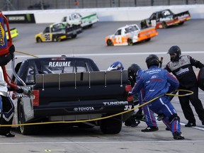 Josh Reaume pits during the NASCAR Truck Series auto race at Kansas Speedway in Kansas City, Kan., Friday, May 10, 2019.