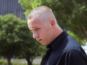 FILE - In this Wednesday, June 13, 2018 file photo, Shane Gaskill, 19, of Wichita, Kan., leaves the federal court in Wichita, Kan. Gaskill, an online gamer whose dispute over a $1.50 bet sparked a hoax call that resulted in police shooting a man who lived at his old address has struck a deal with prosecutors for an alternative to prosecution. U.S. District Judge Eric Melgren approved on Friday, May 24, 2019 the joint motion for deferred prosecution that had been filed earlier in the day by prosecutors and the attorney for 20-year-old Shane Gaskill of Wichita.